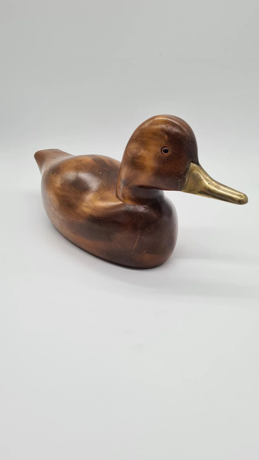 Hand-carved duck with brass and glass elements, Germany, 1960s/70s