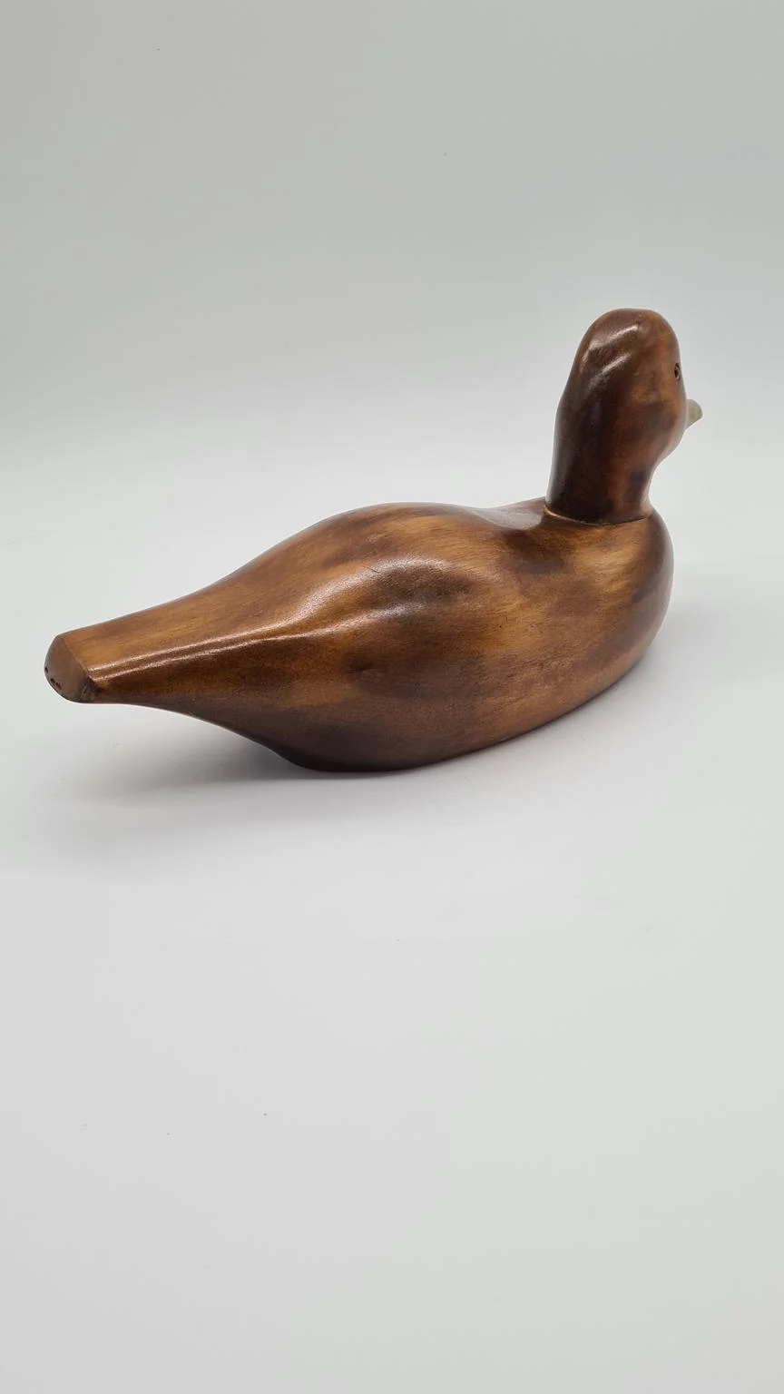 Hand-carved duck with brass and glass elements, Germany, 1960s/70s