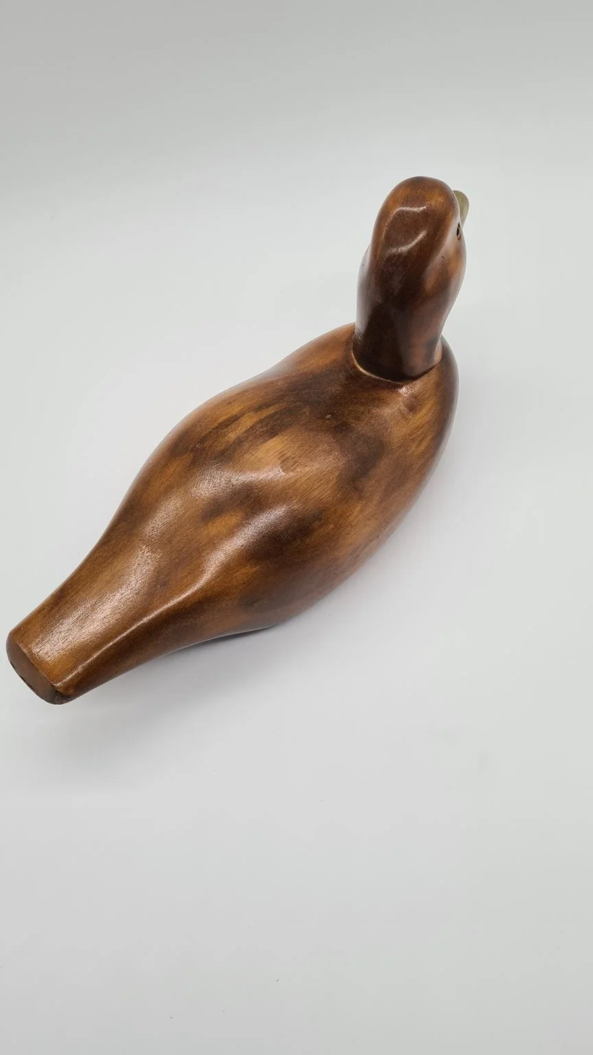 Hand-carved duck with brass and glass elements, Germany, 1960s/70s