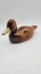Hand-carved duck with brass and glass elements, Germany, 1960s/70s