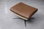 Leather swivel armchair with footstool, Denmark, 1970s