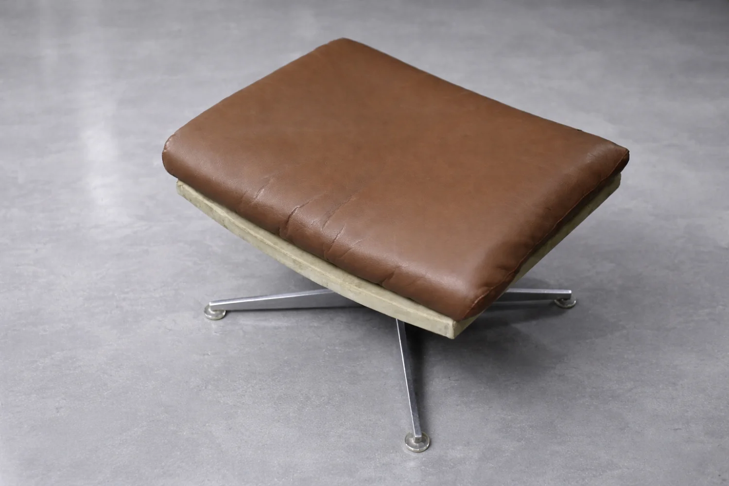 Leather swivel armchair with footstool, Denmark, 1970s