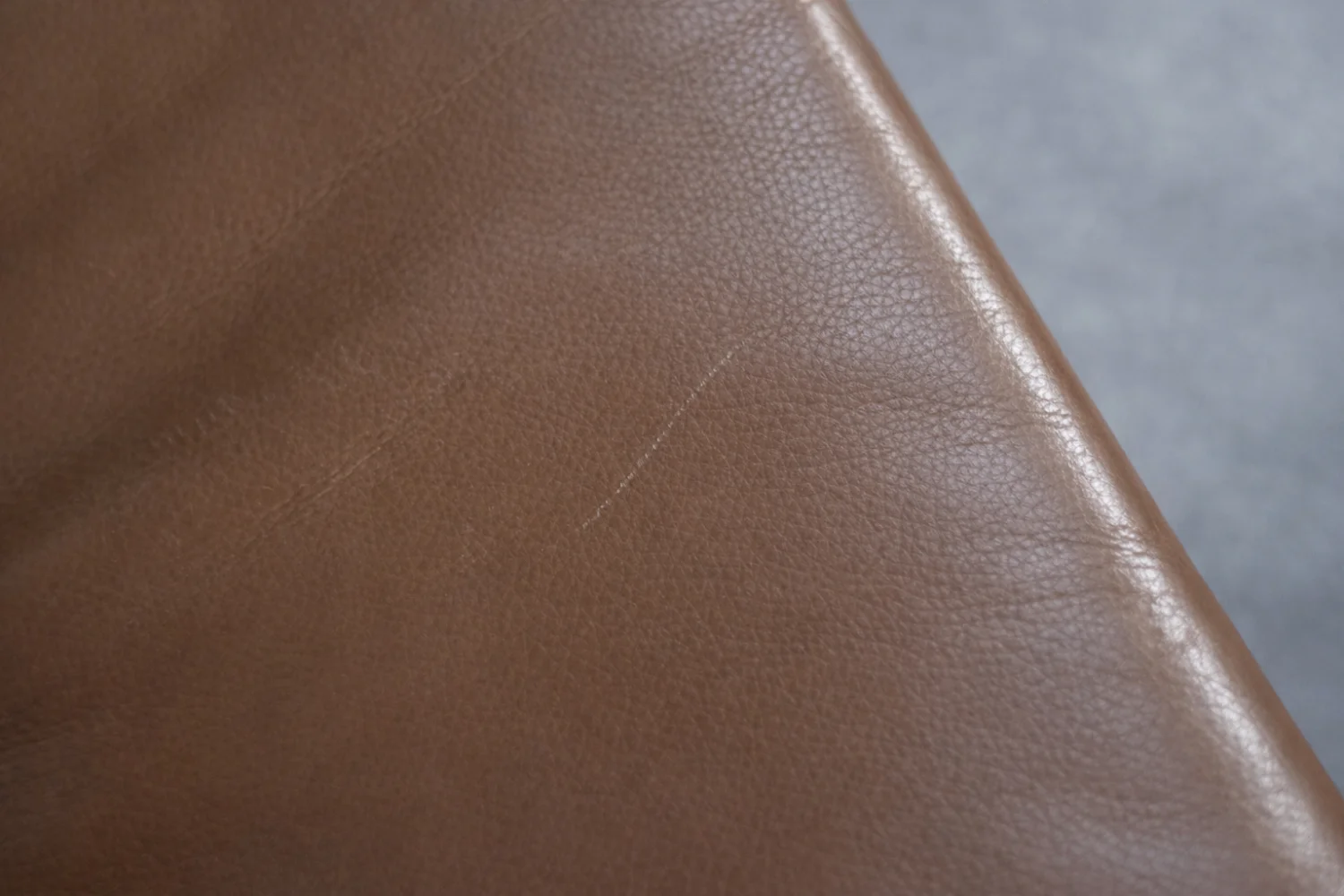 Leather swivel armchair with footstool, Denmark, 1970s