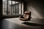 Leather swivel armchair with footstool, Denmark, 1970s