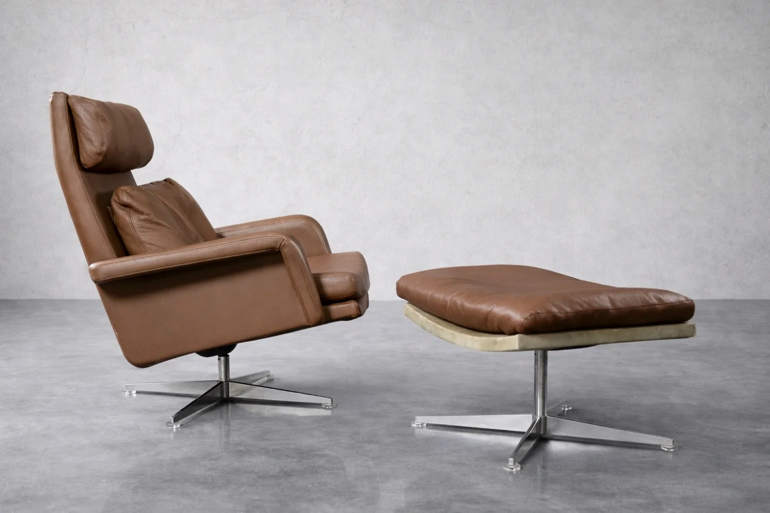 Leather swivel armchair with footstool, Denmark, 1970s