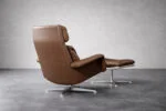 Leather swivel armchair with footstool, Denmark, 1970s