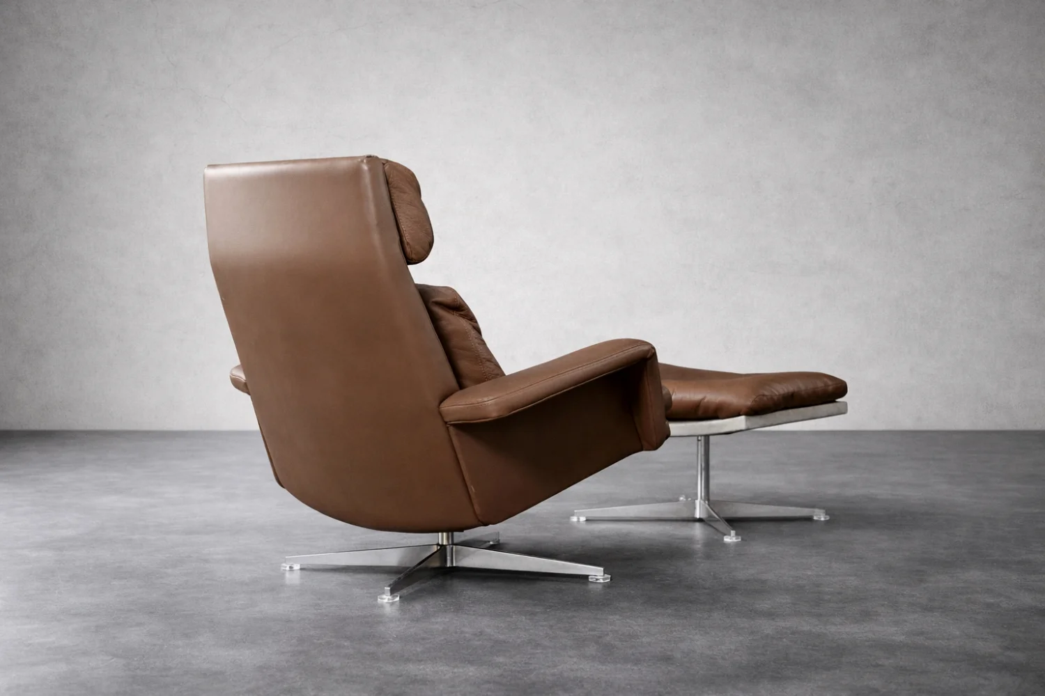 Leather swivel armchair with footstool, Denmark, 1970s
