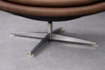 Leather swivel armchair with footstool, Denmark, 1970s