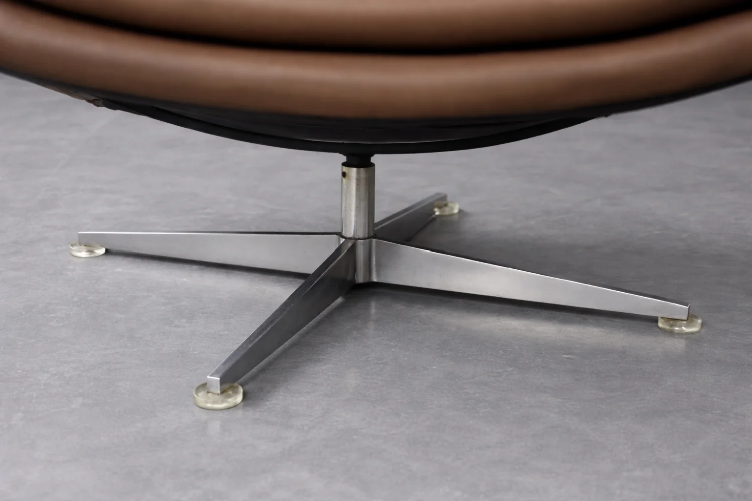 Leather swivel armchair with footstool, Denmark, 1970s