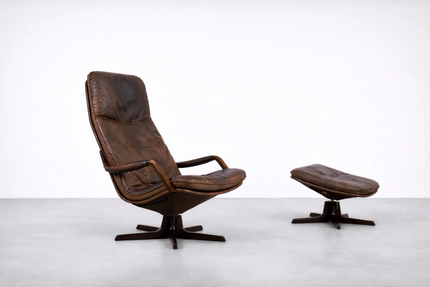 Leather armchair with footstool, Berg Furniture, Denmark, 1970s