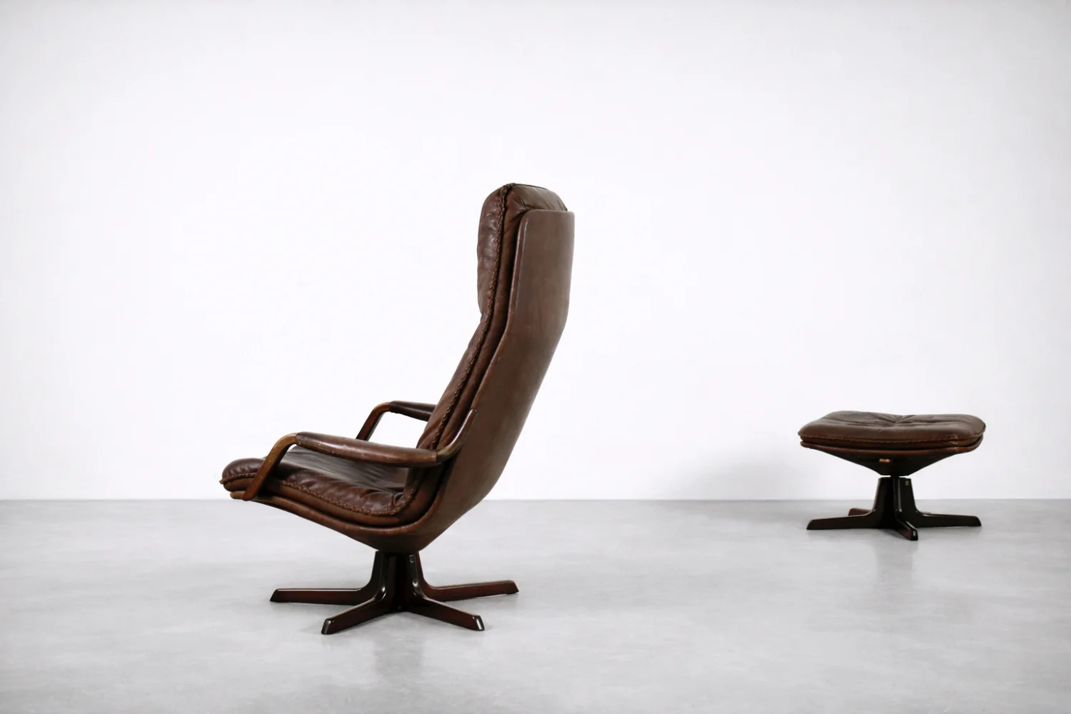 Leather armchair with footstool, Berg Furniture, Denmark, 1970s