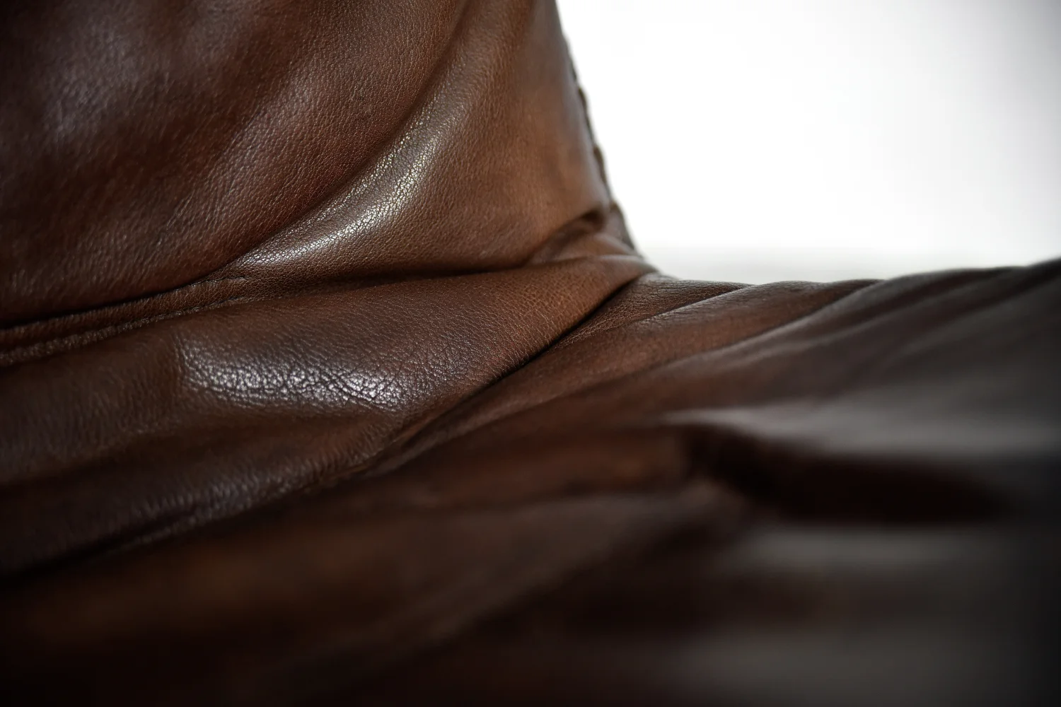 Leather armchair with footstool, Berg Furniture, Denmark, 1970s