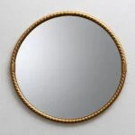 Round Hollywood Regency wall mirror in a brass frame, 1970s