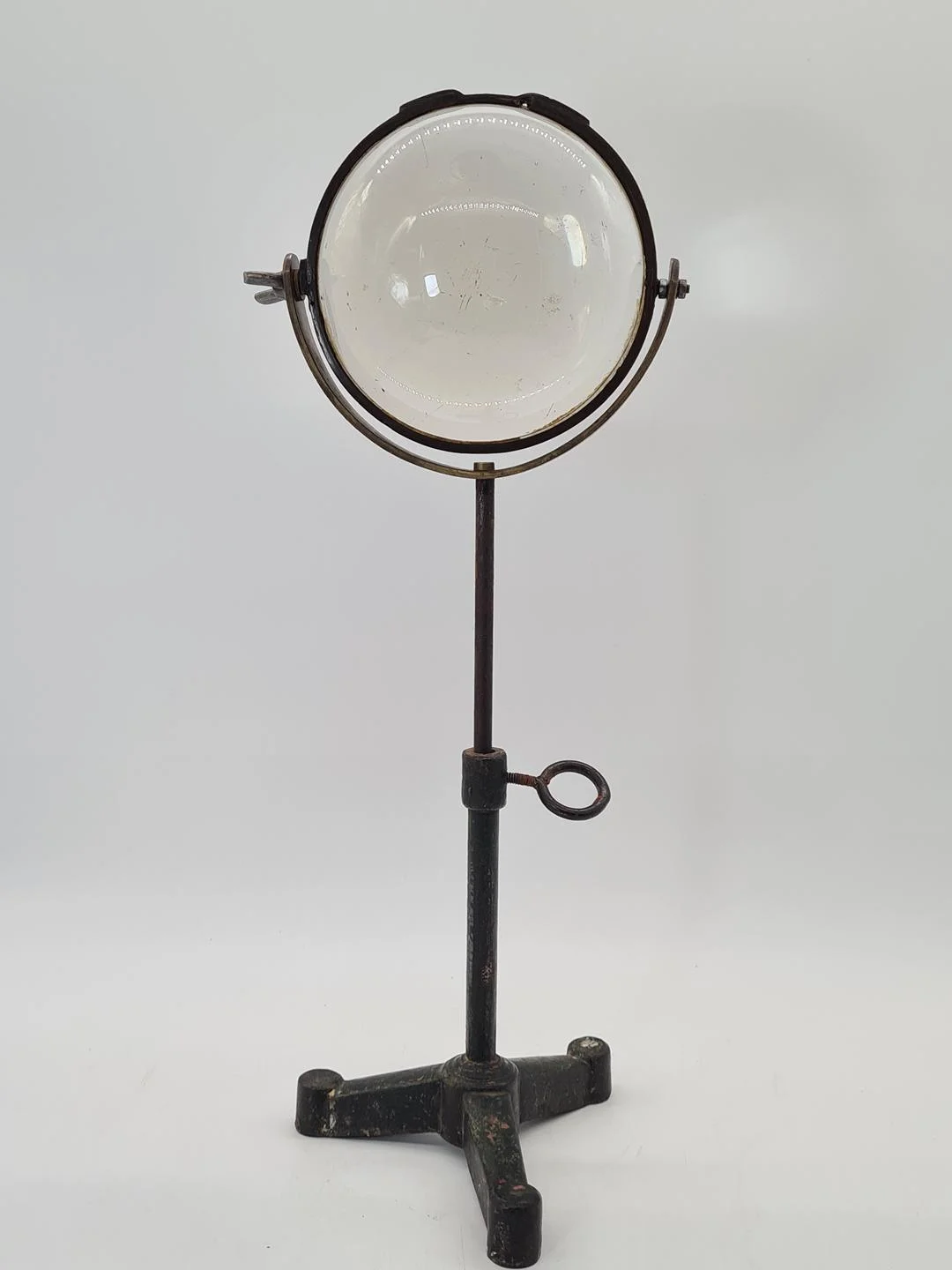 Optical lens on a cast iron stand, 19th century