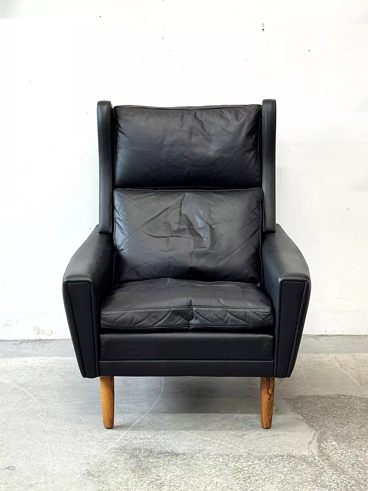 Leather wingback armchair, Denmark, 1970s