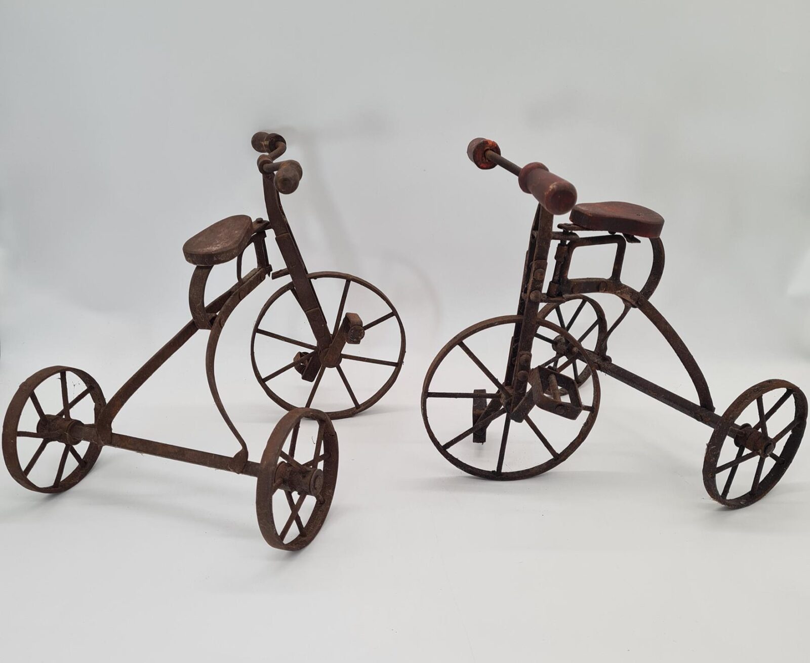 Set of 2 vintage miniature metal tricycles, 1970s