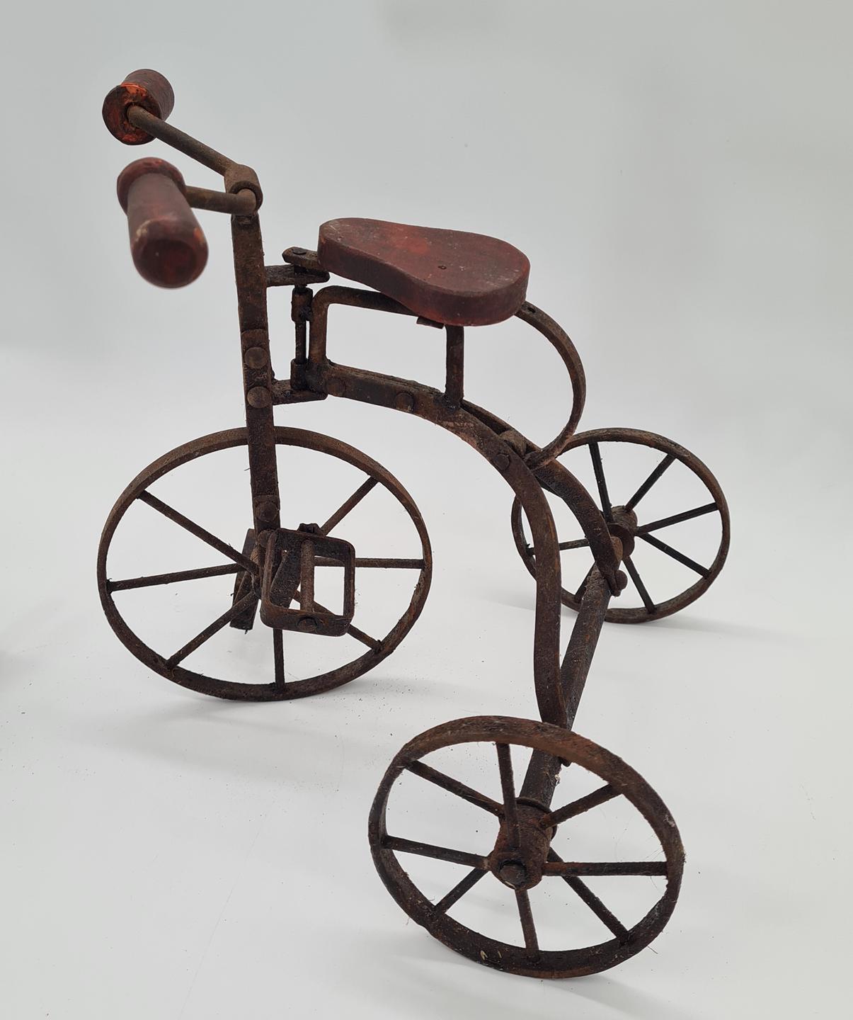 Set of 2 vintage miniature metal tricycles, 1970s