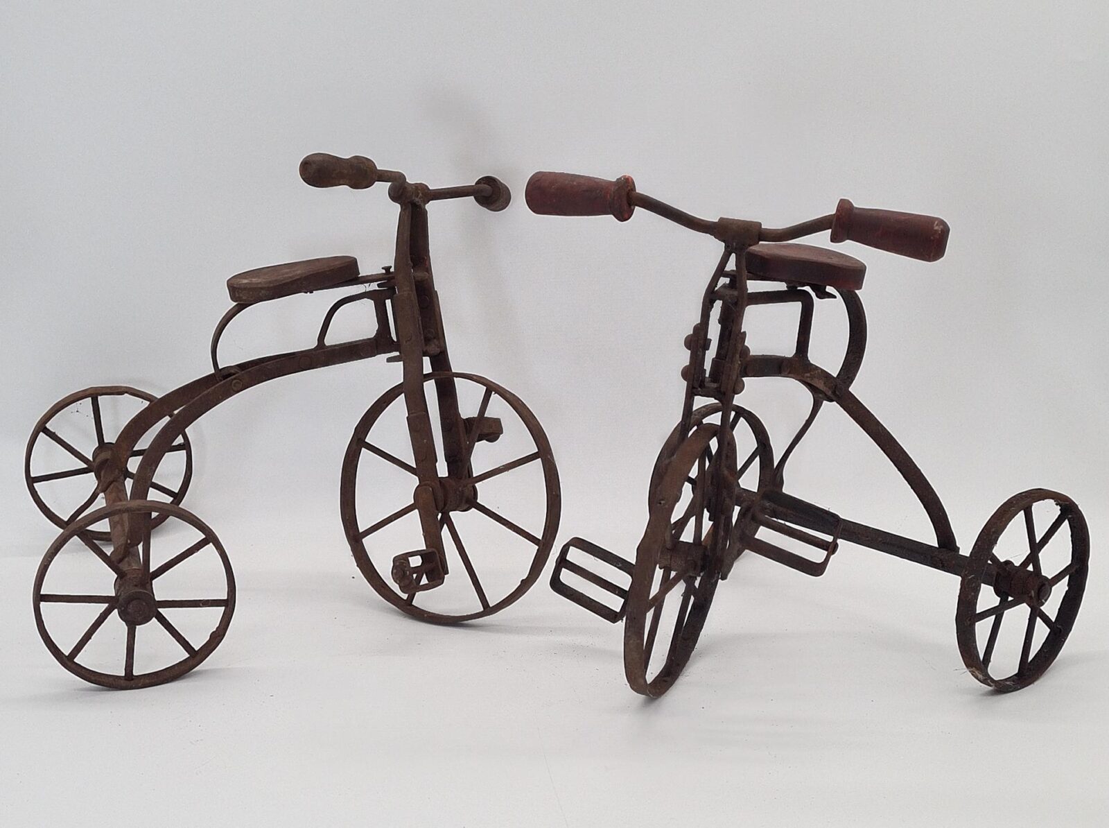 Set of 2 vintage miniature metal tricycles, 1970s