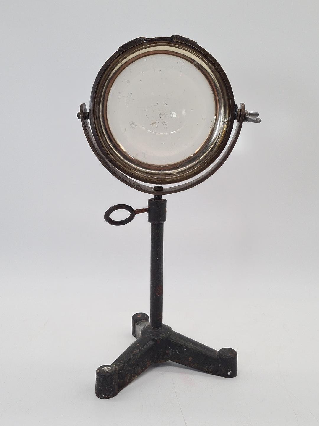 Optical lens on a cast iron stand, 19th century